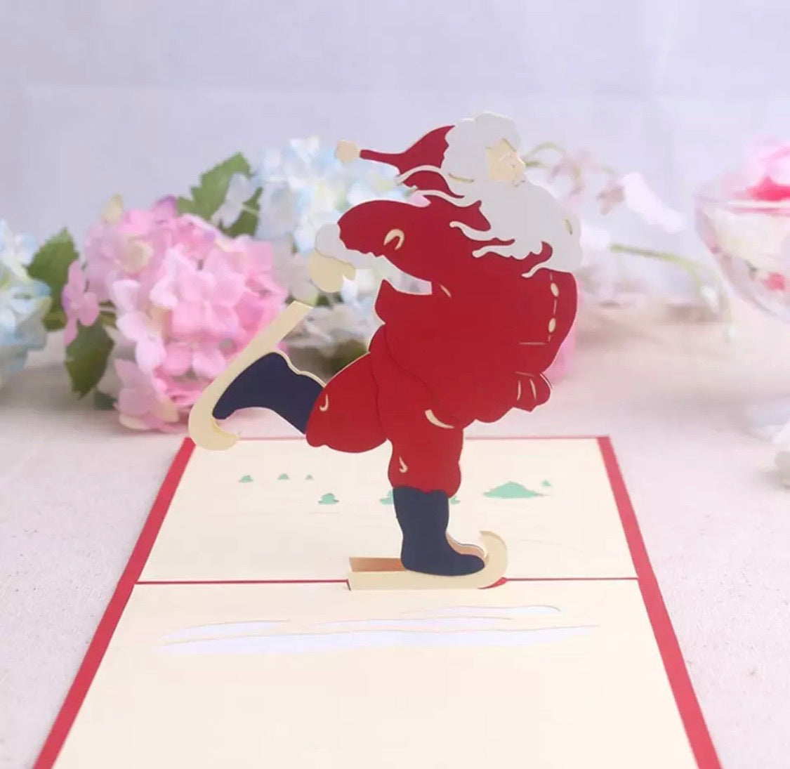 Santa on Skates Pop-Up Card - Clé de Coeur